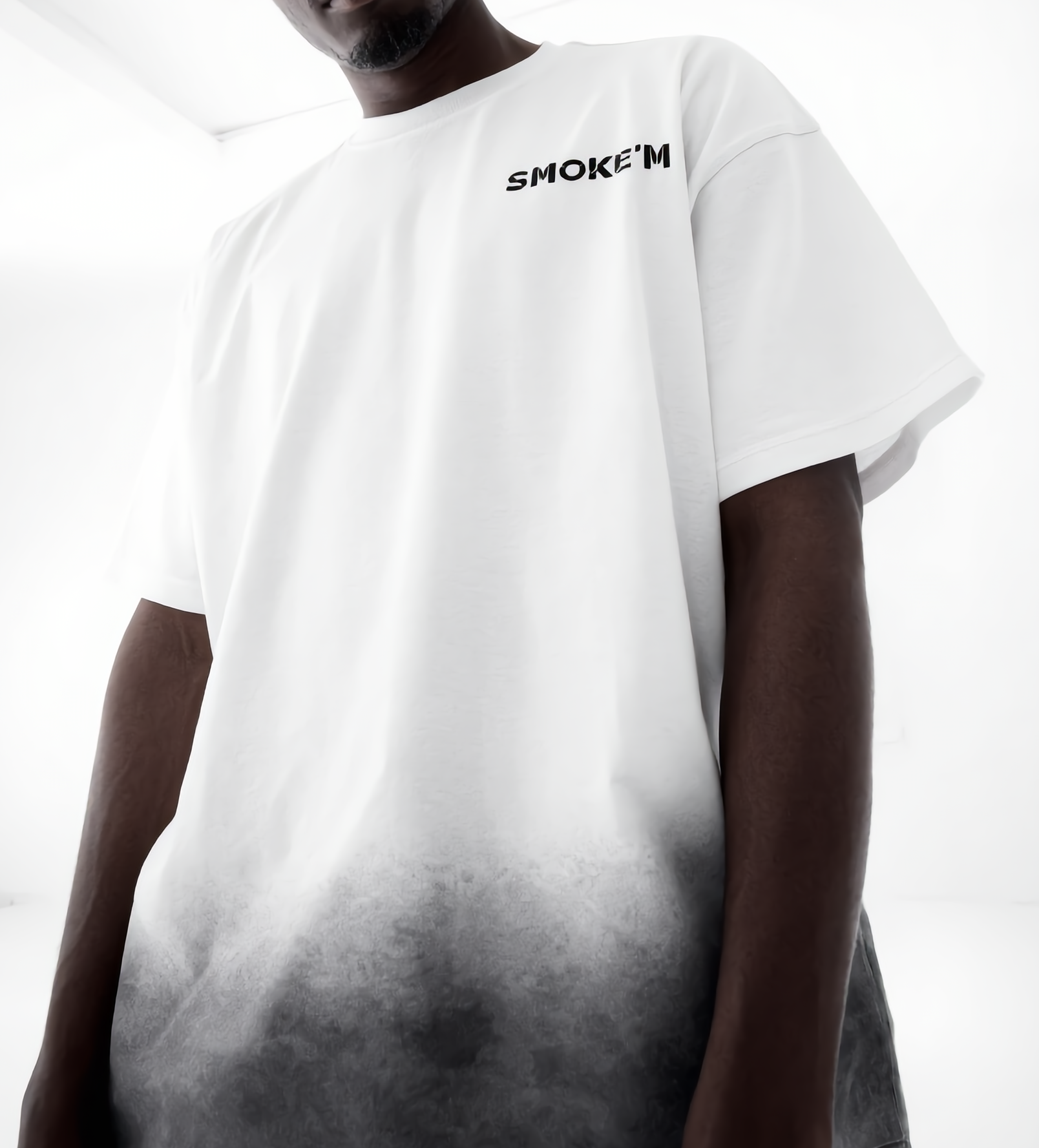 Person wearing a white t-shirt with 'SMOKEM' text on a gradient background