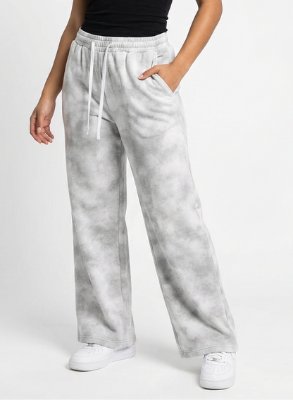 Woman wearing gray sweatpants on a white background